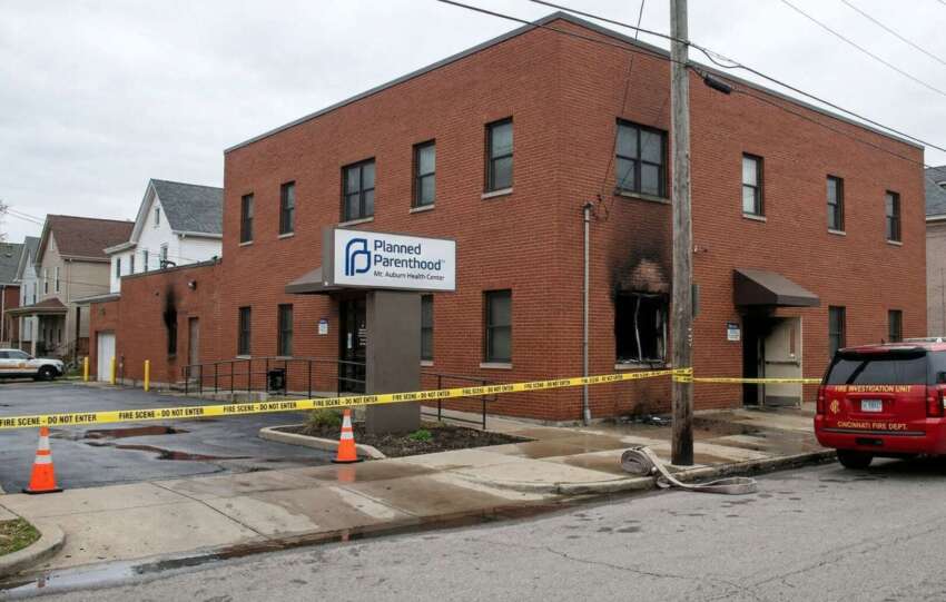 Cincinnati Planned Parenthood building cordoned off with yellow caution tape during a fire investigation.