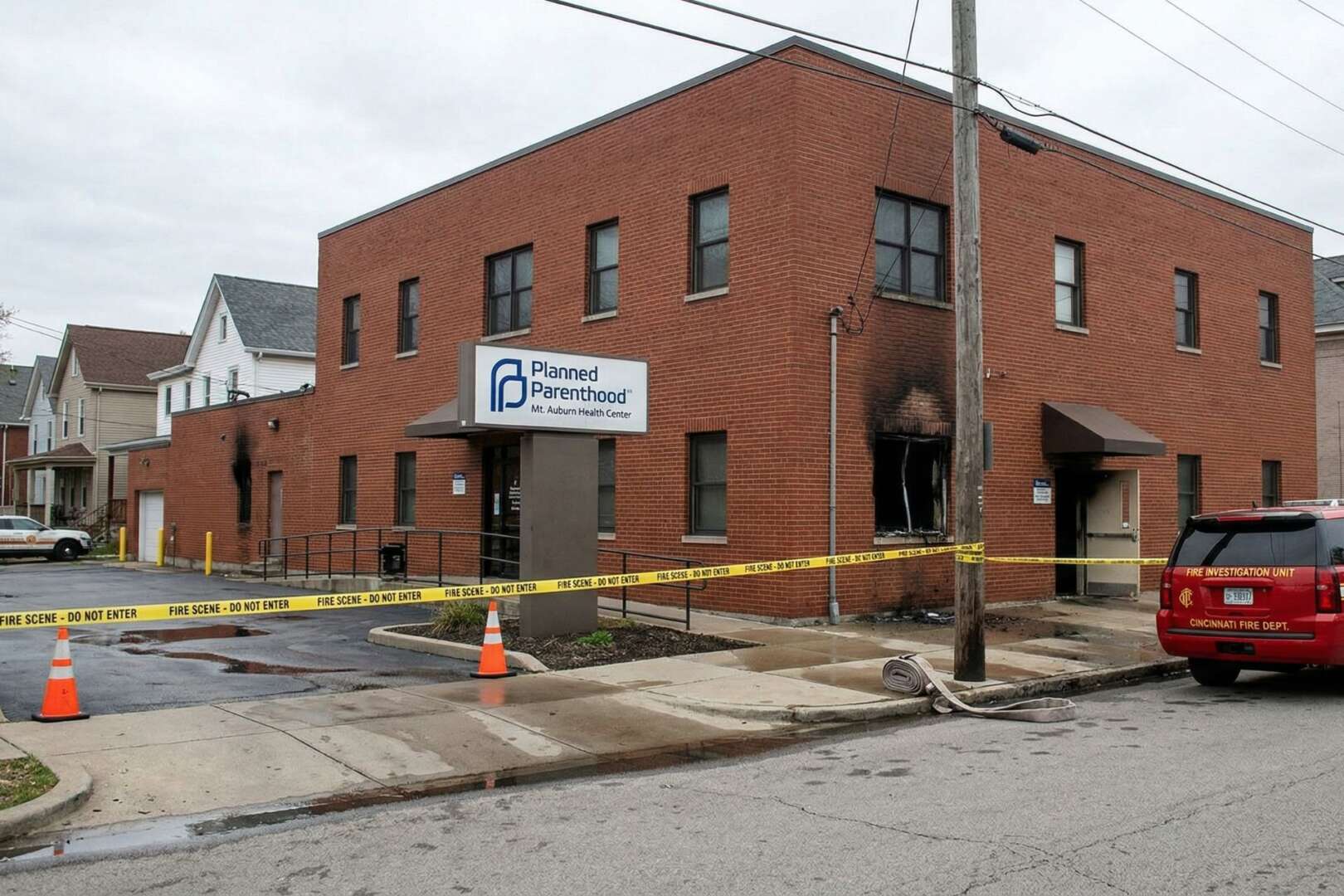 Cincinnati Planned Parenthood building cordoned off with yellow caution tape during a fire investigation.