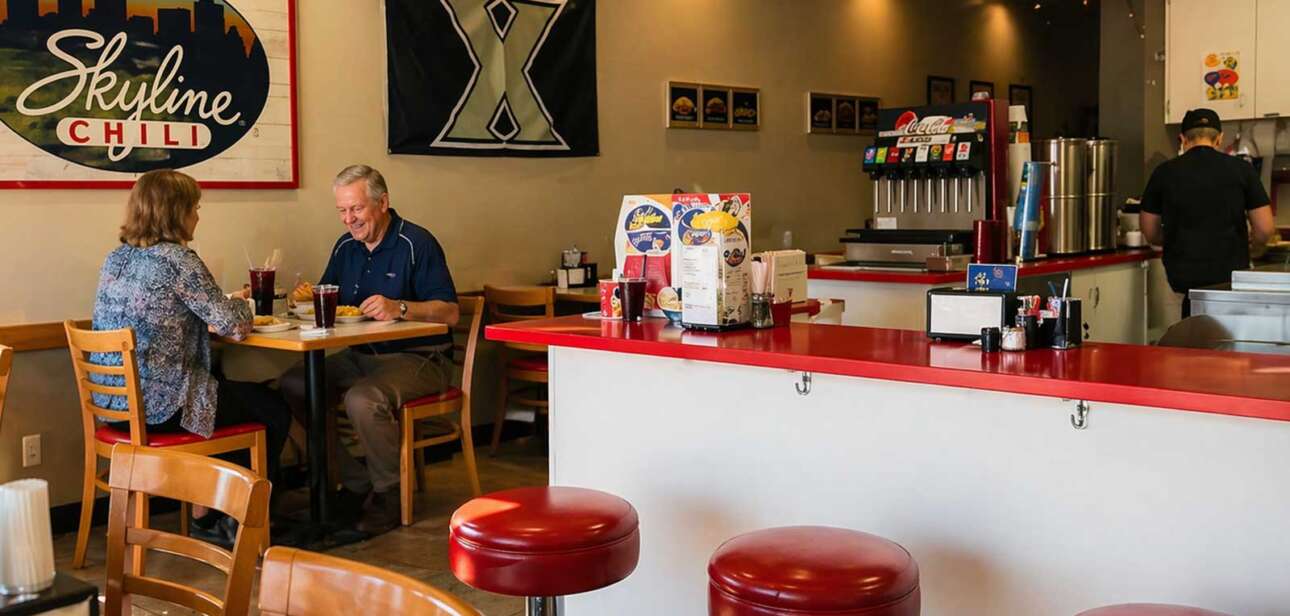 Skyline Chili Florida restaurant interior with customers dining at tables and counter seating in a bright scene