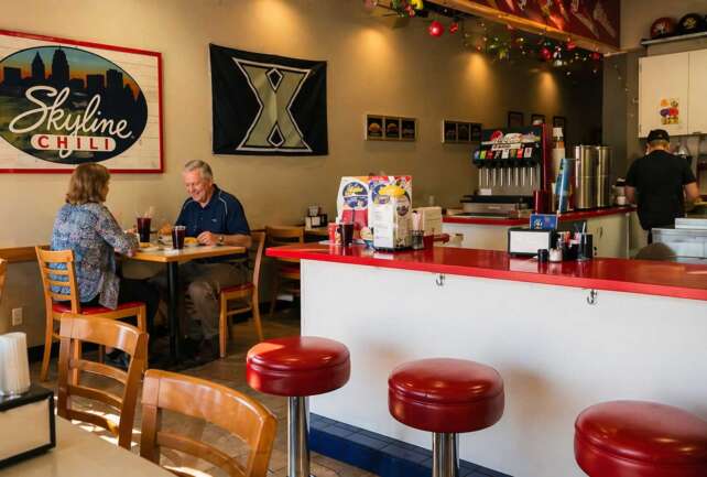 Skyline Chili Florida restaurant interior with customers dining at tables and counter seating in a bright scene