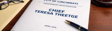 Theetge report document on desk in legal office setting Cincinnati Police review