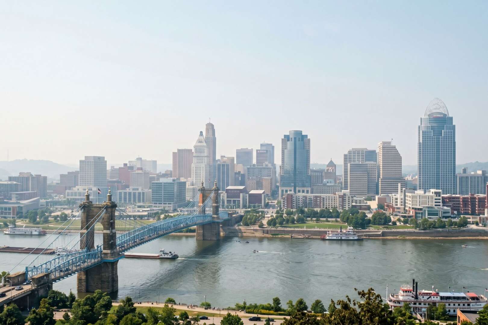 A slightly hazy view of the Cincinnati skyline and the John A. Roebling Suspension Bridge over the Ohio River during a regional air quality alert.