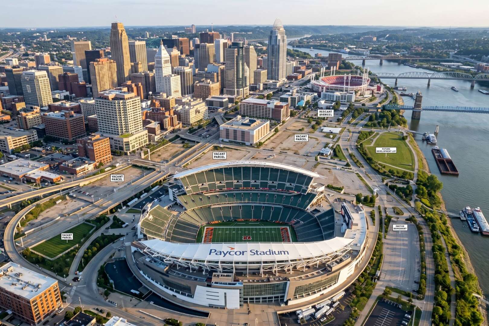 Aerial view of Paycor Stadium and the downtown Cincinnati skyline along the Ohio River.