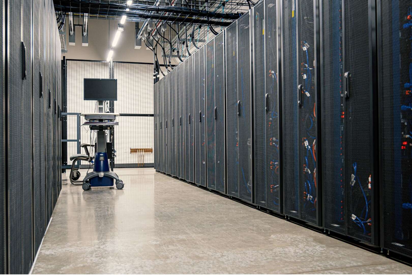 Rows of server racks in a bright, modern data center aisle representing Cincinnati's tech infrastructure growth.