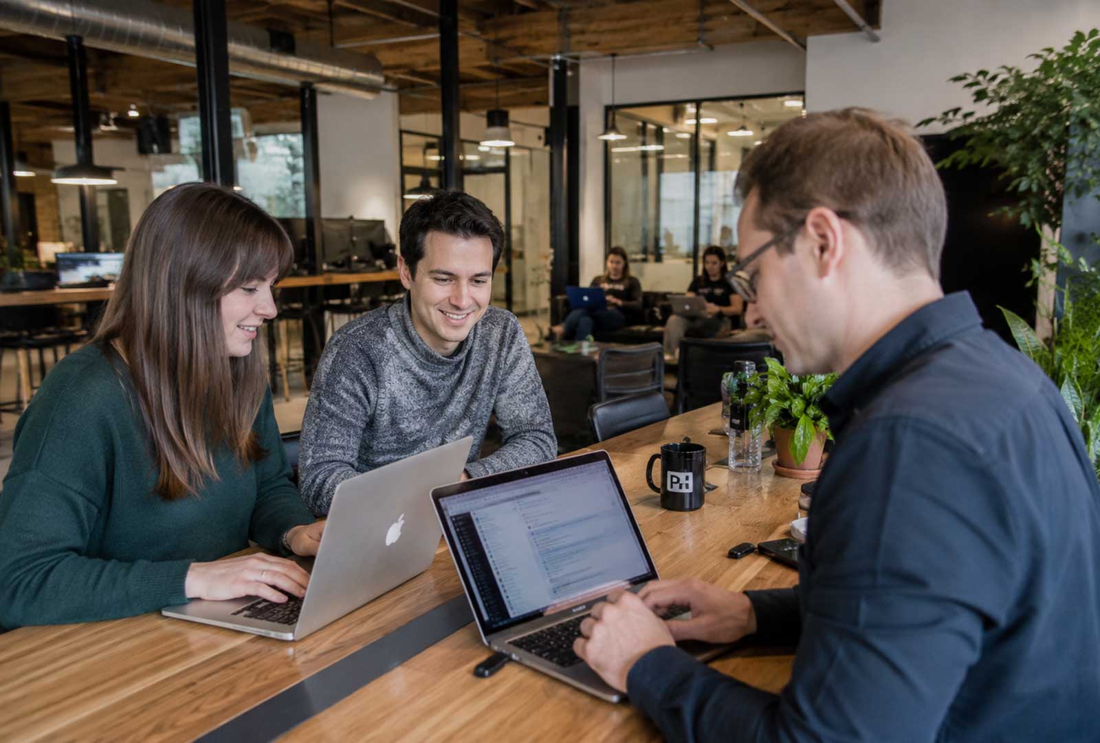 Startup professionals collaborating in a modern office, illustrating Ohio's business ranking as #1 and the Greater Cincinnati region's cross-state economy.