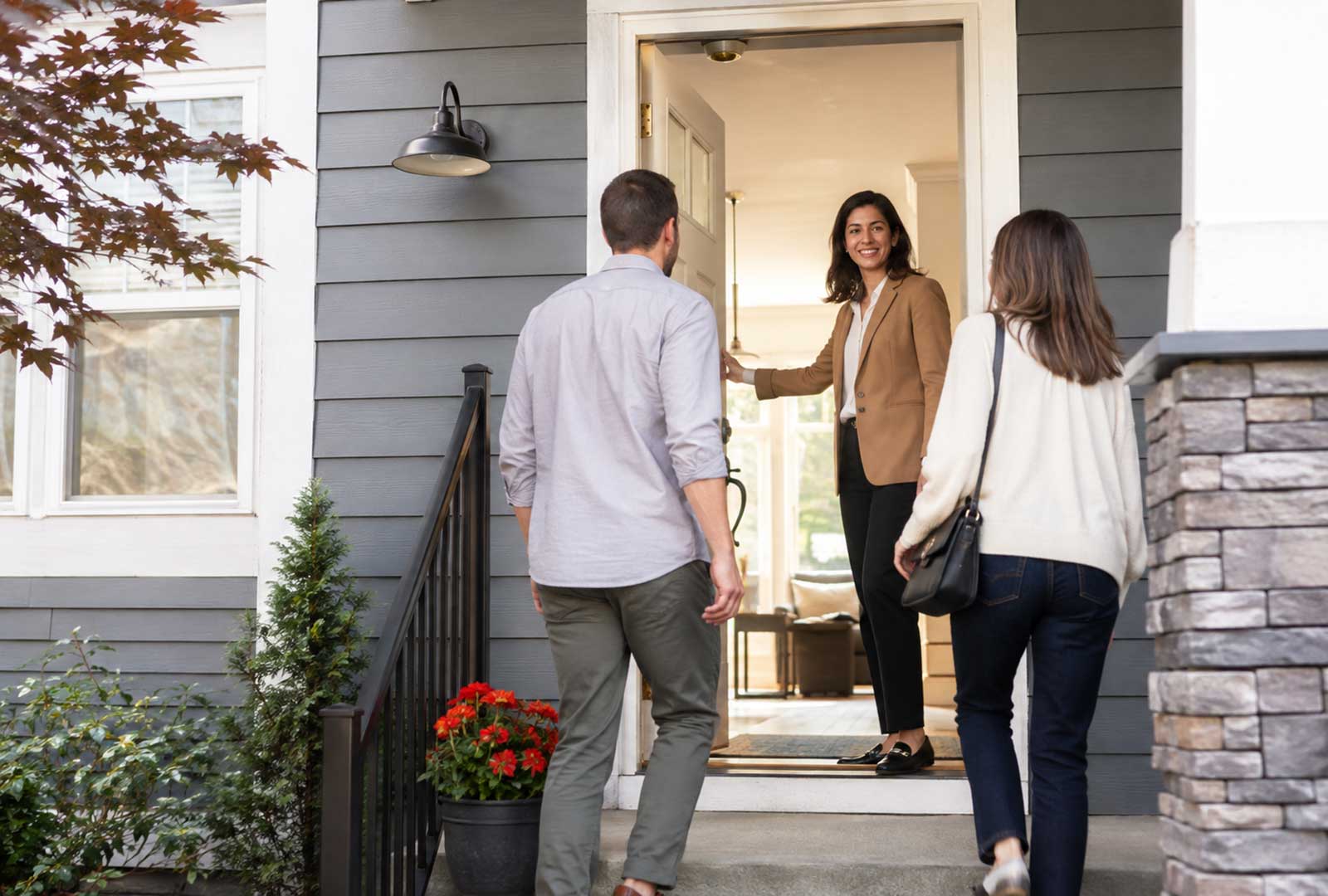 A Cincinnati-area Realtor walks prospective buyers through a home for sale as Cincinnati housing inventory grows in the Greater Cincinnati market.