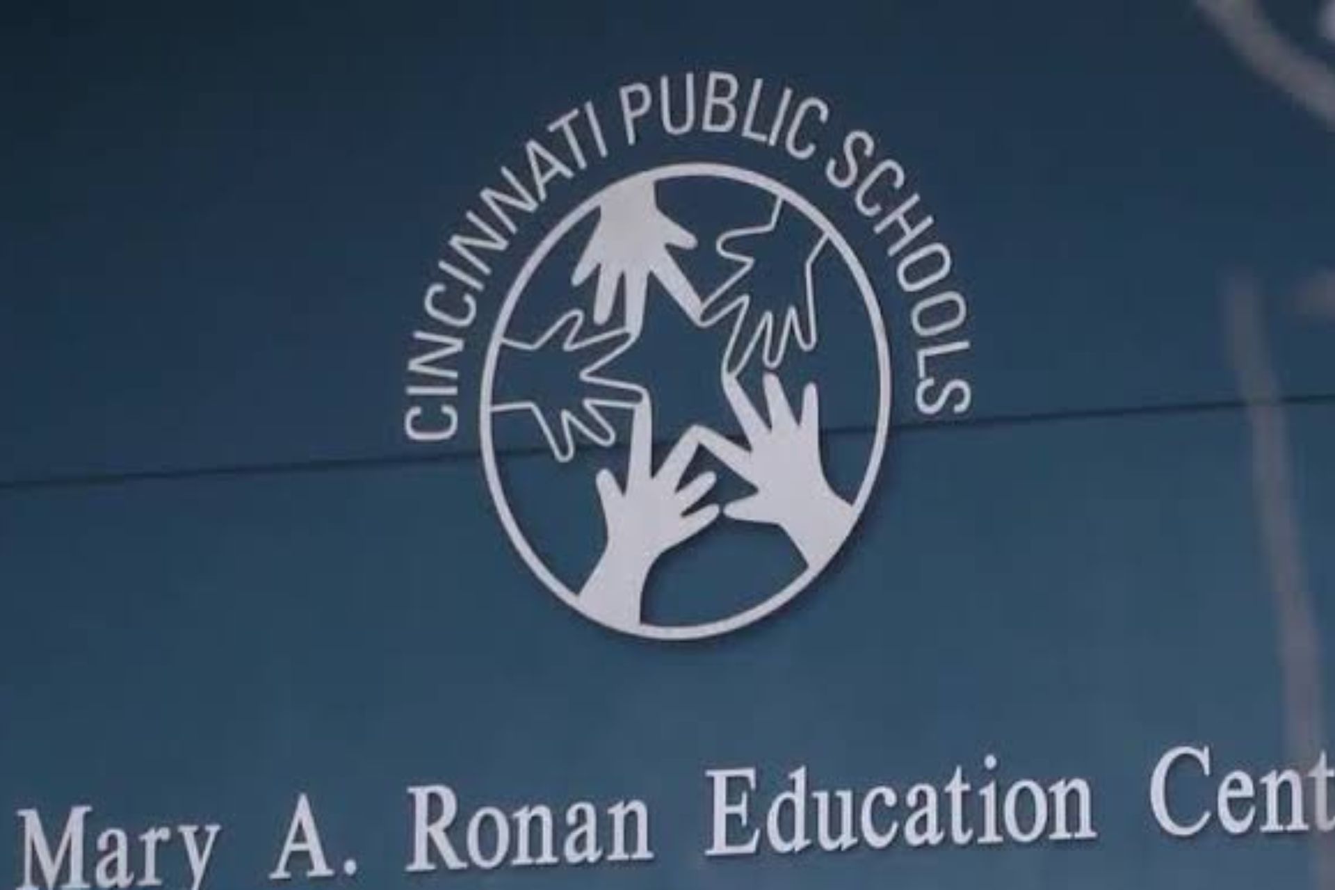 The Cincinnati Public Schools logo on the exterior wall of the Mary A. Ronan Education Center.
