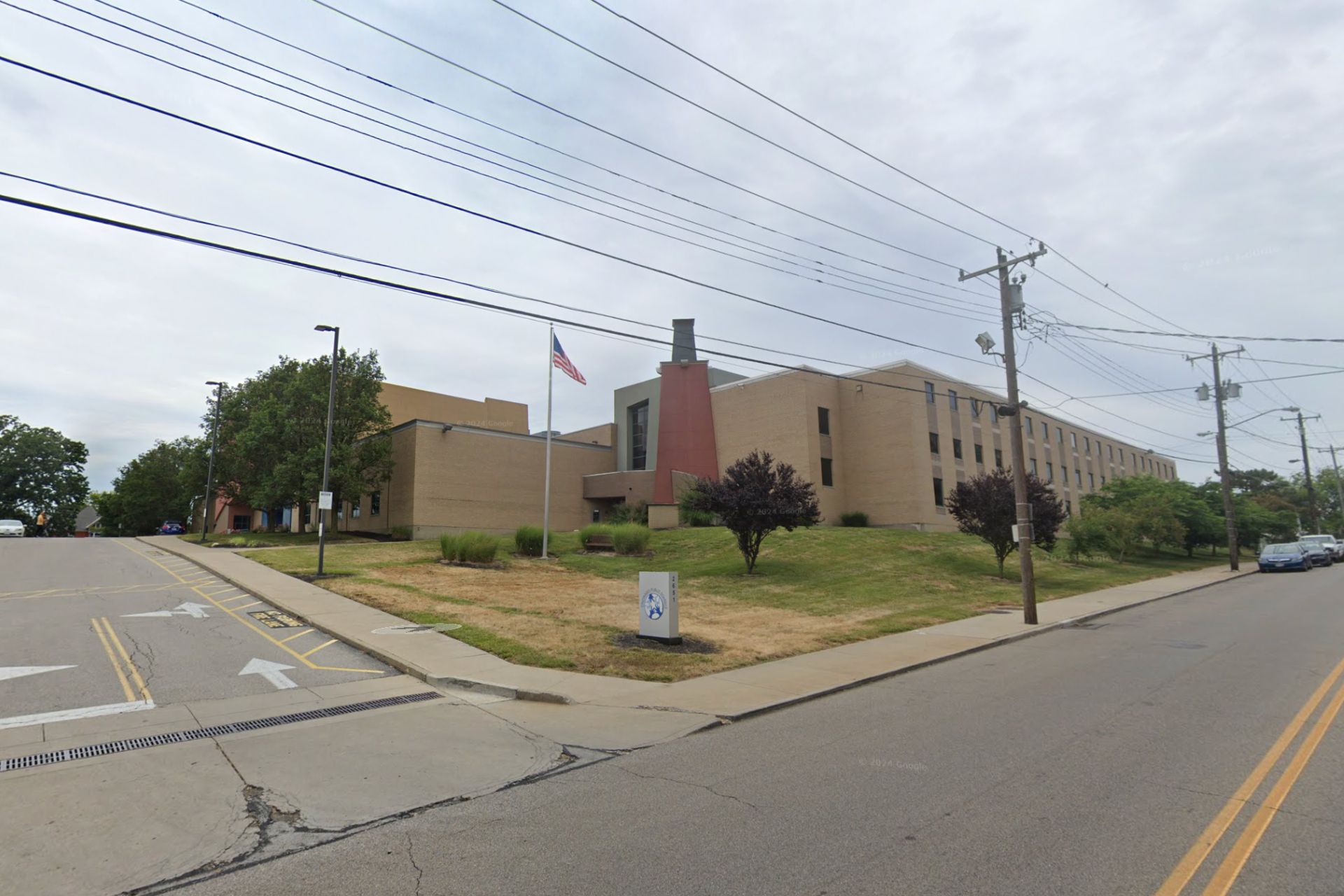 Exterior view of a Cincinnati Public Schools building at a street intersection.