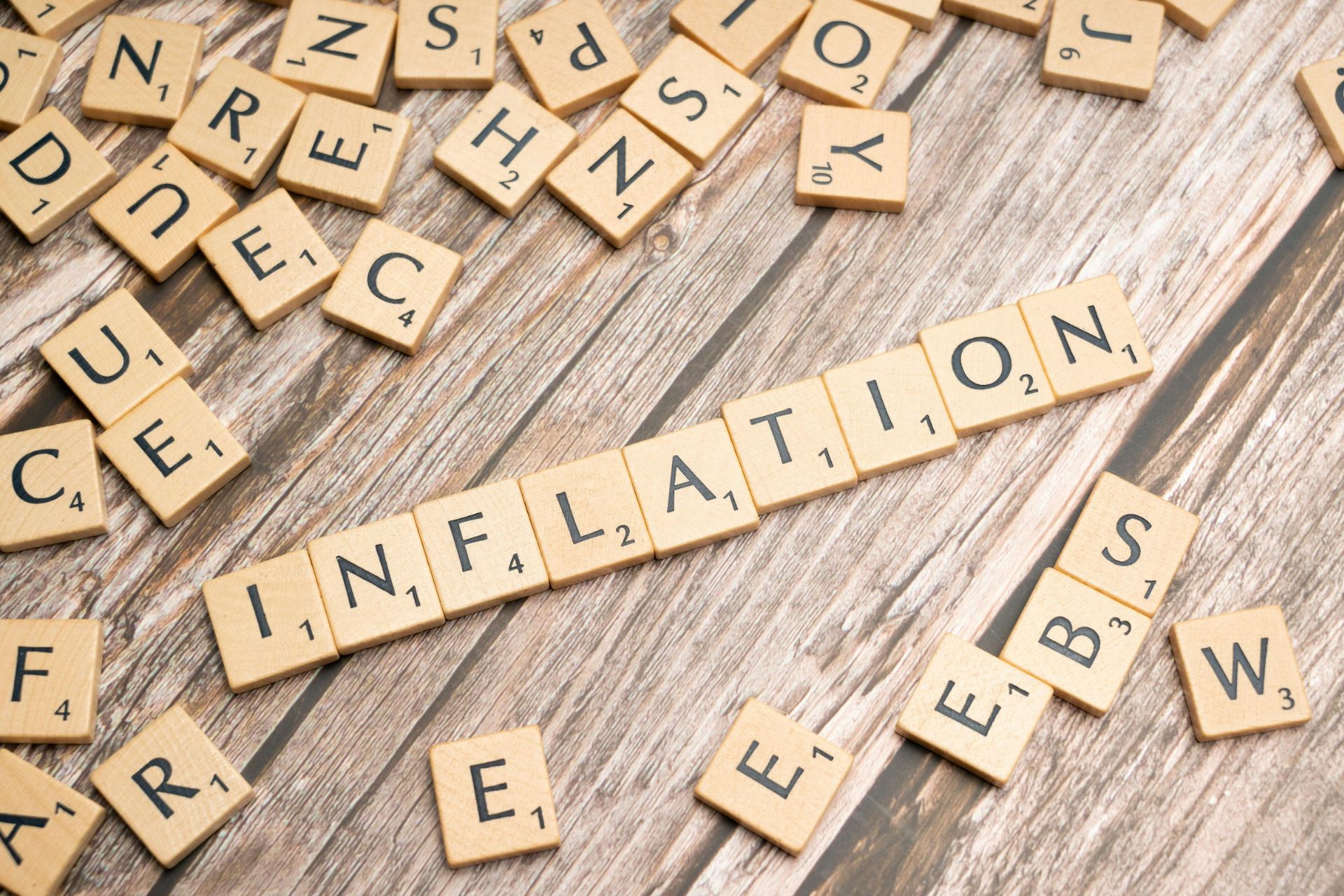 Wooden letter tiles spelling the word inflation to represent the rising cost of living in Cincinnati.