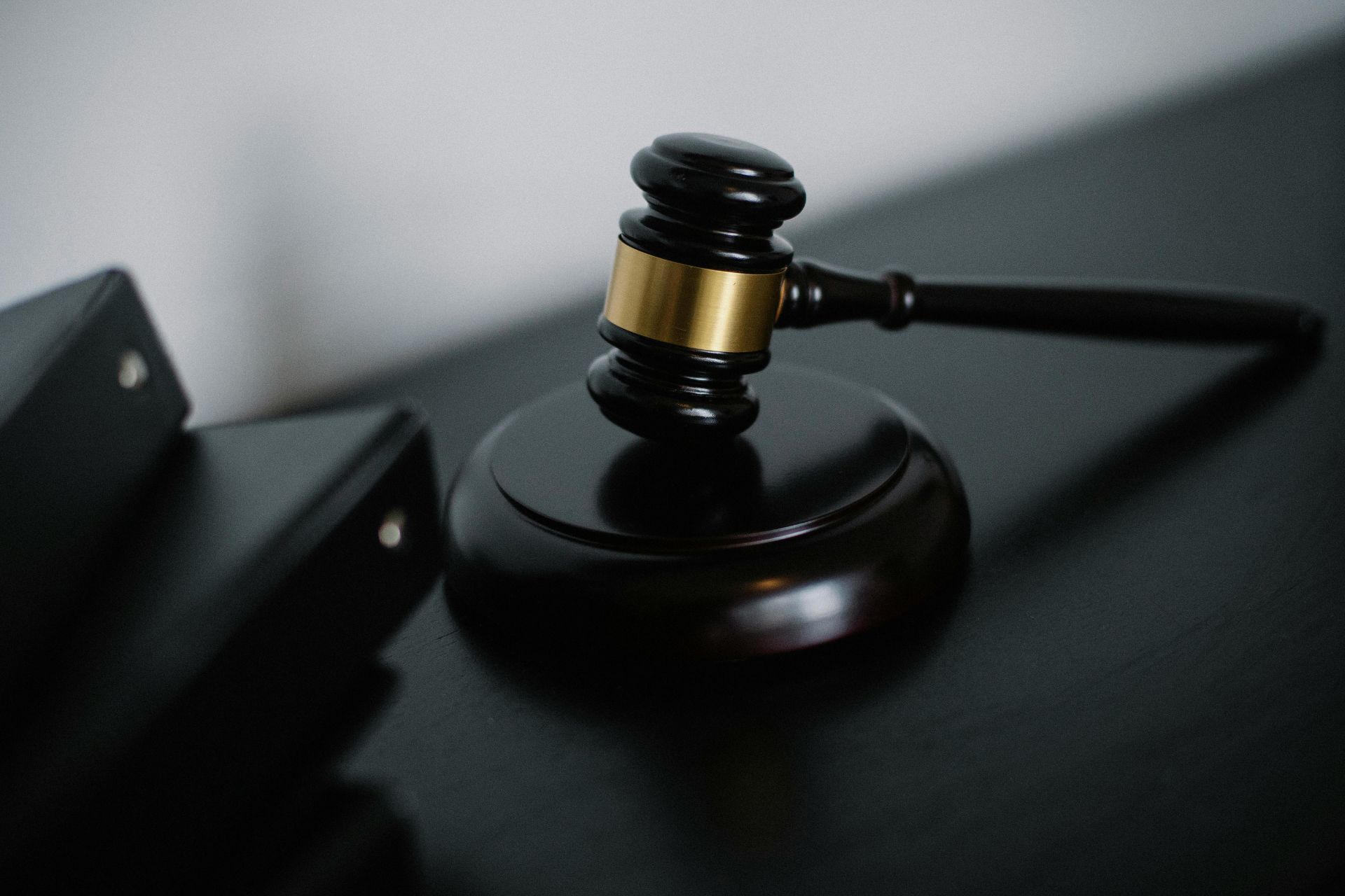 Wooden judge's gavel and sound block for the Michael Washington lawsuit and court trial.