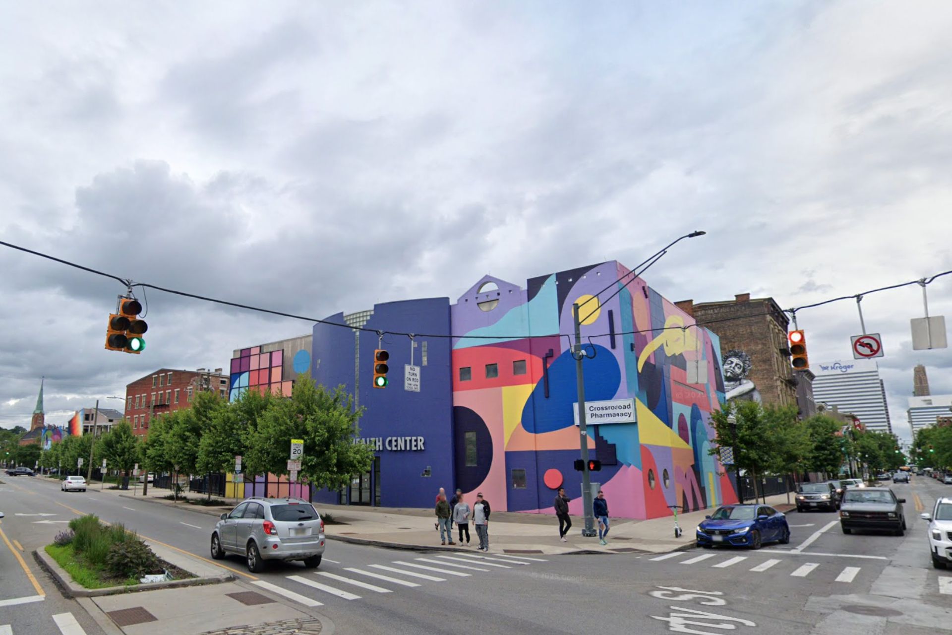 Colorful mural on the Crossroad Health Center building at a street intersection in Over-the-Rhine, Cincinnati.