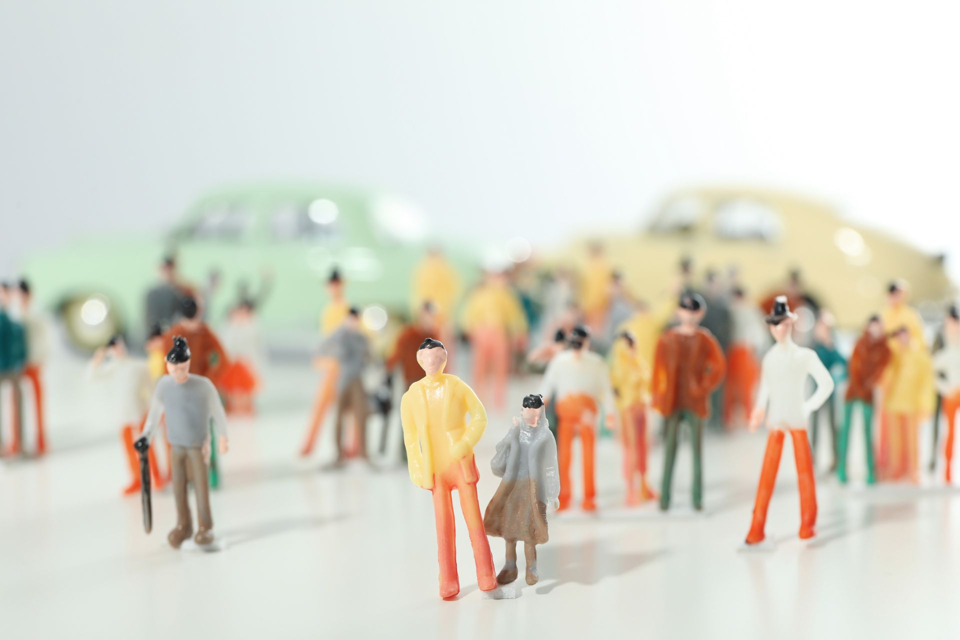 Miniature toy figurines of people and cars representing population growth and urban communities in Cincinnati.