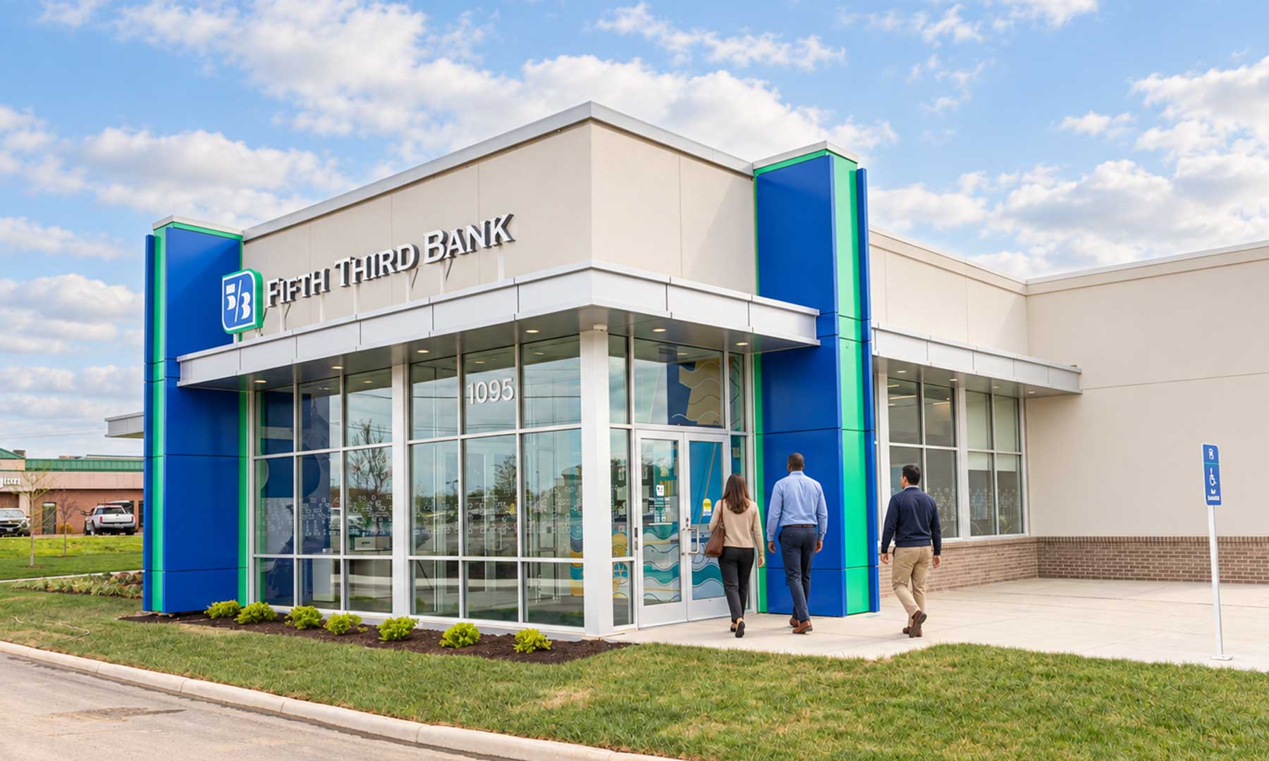 Fifth Third Comerica customers walk into a Fifth Third Bank branch.