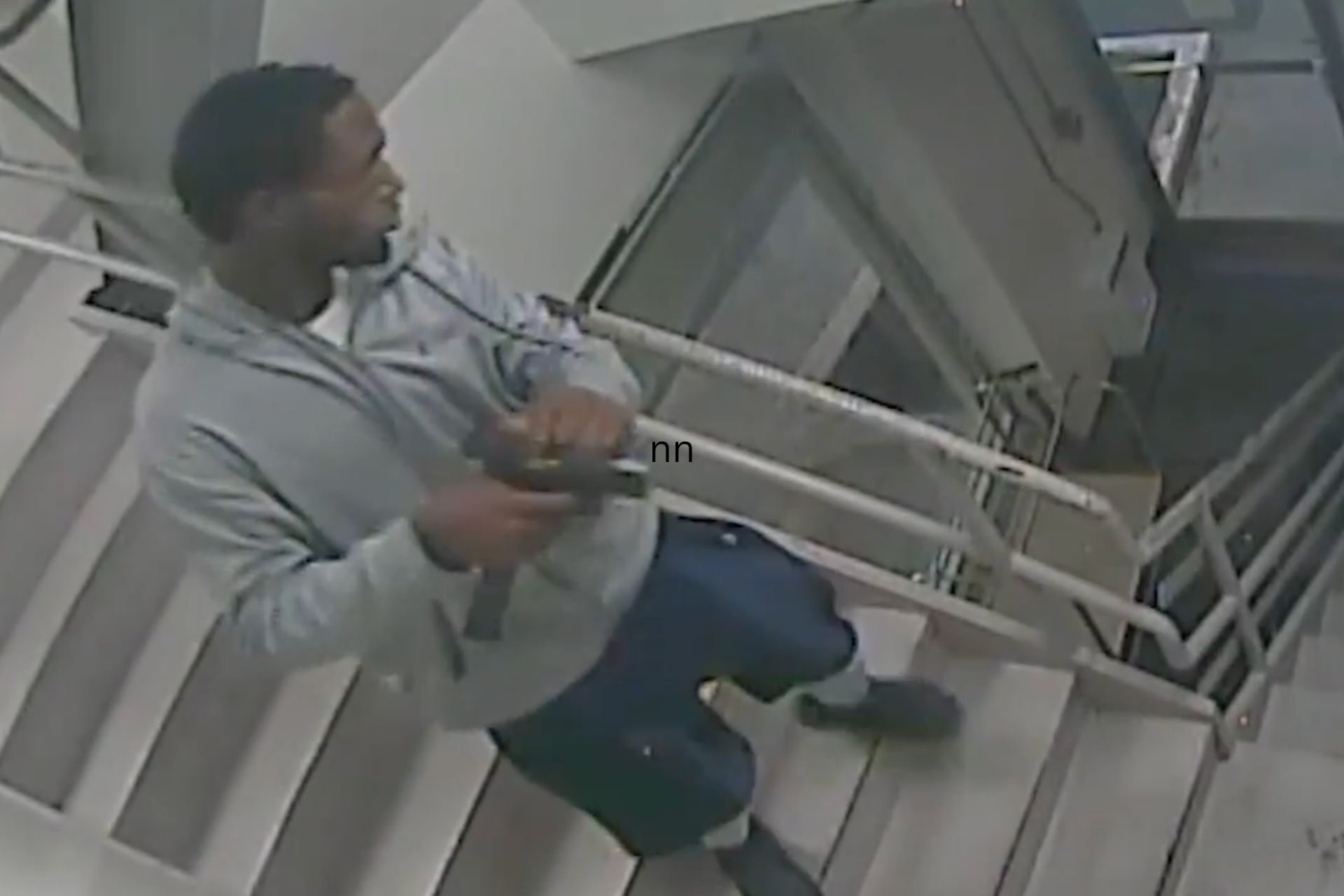 Male suspect holding a firearm on a stairwell, from Cincinnati police regarding the Talbert House shooting.