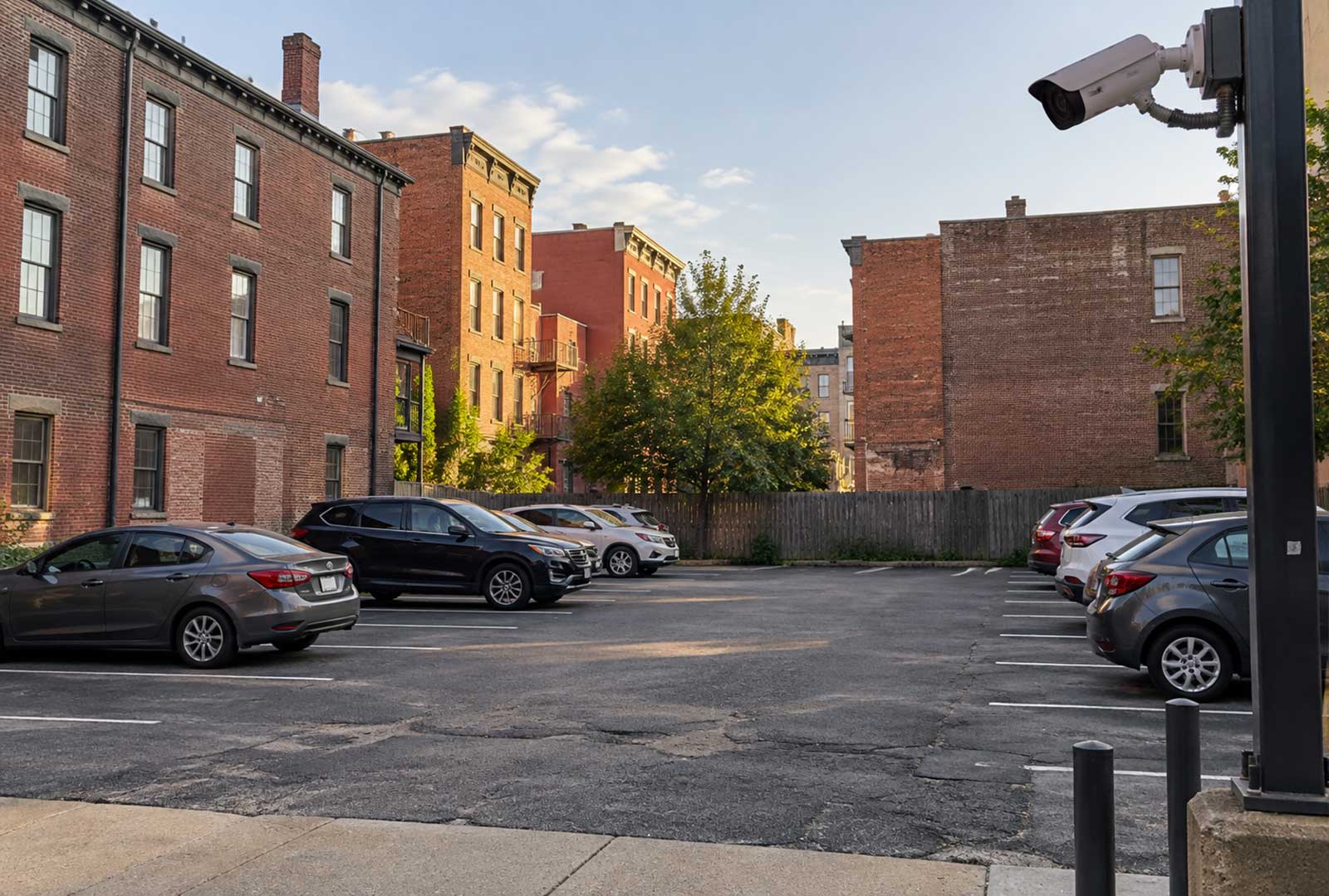 Security camera overlooking a small urban parking lot, illustrating Cincinnati’s parking security ordinance.